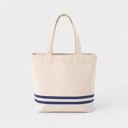 Small canvas tote with two navy stripes, shown on a pale background
